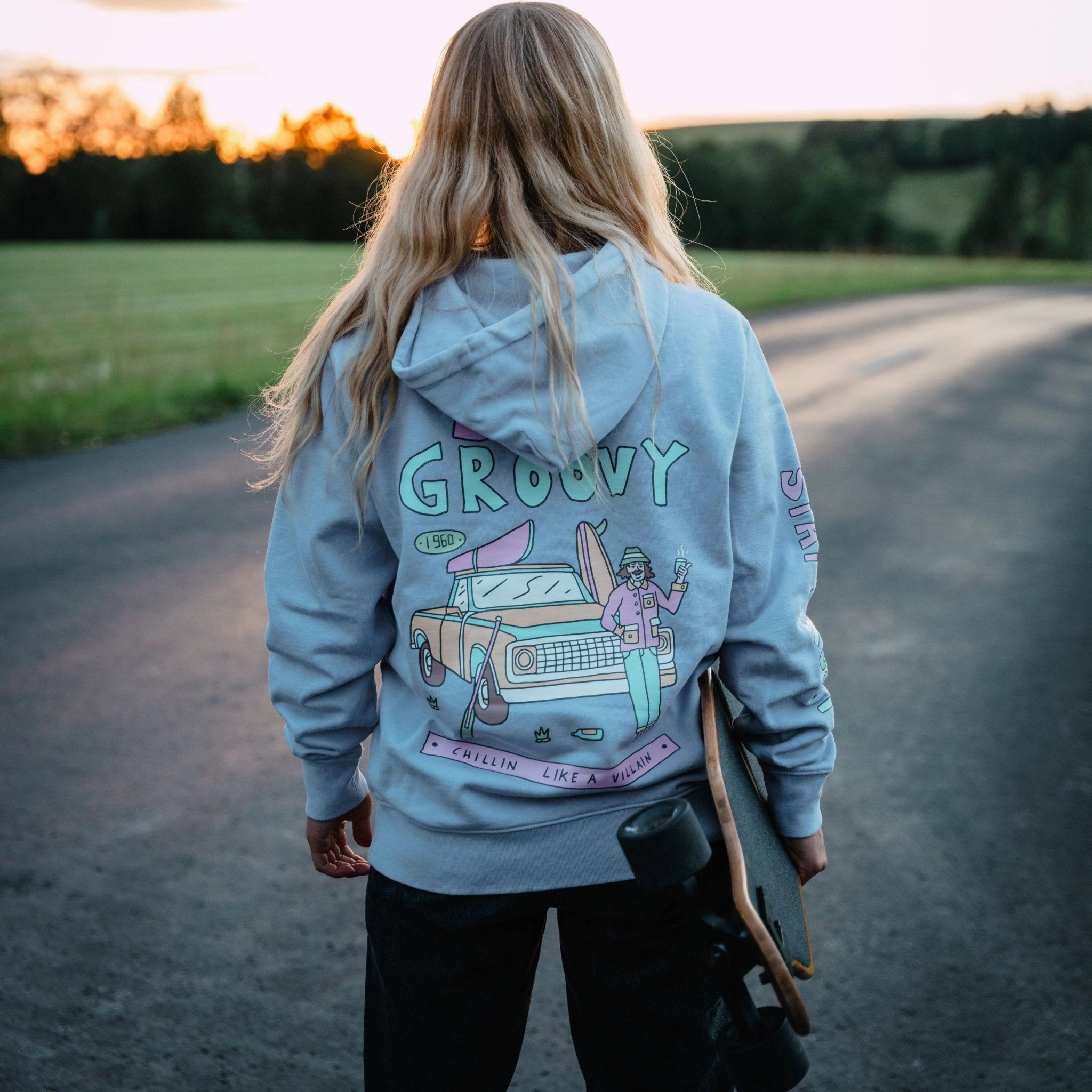 Organic "Stay Groovy" Hoodie Lounging At Home